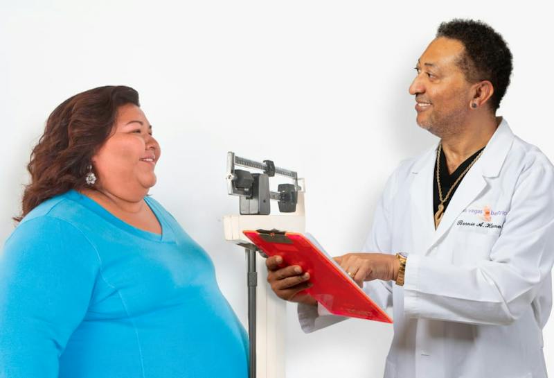 Dr. Bernie Hanna with a female patient