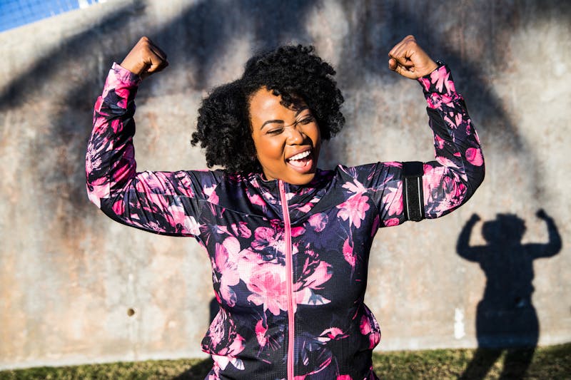 Woman smiling and flexing