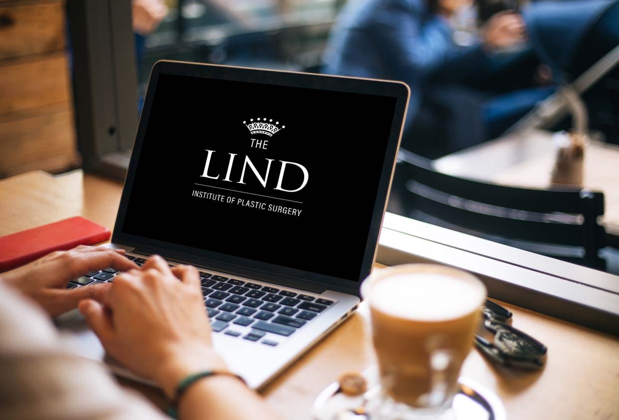 laptop with the lind logo on the screen