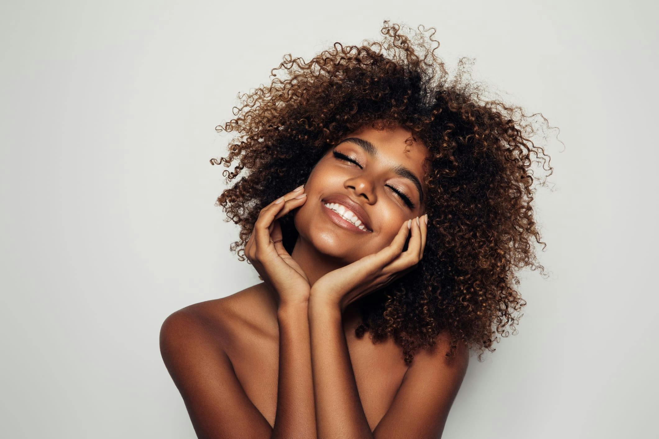 Woman with eyes closed with a joyful expression