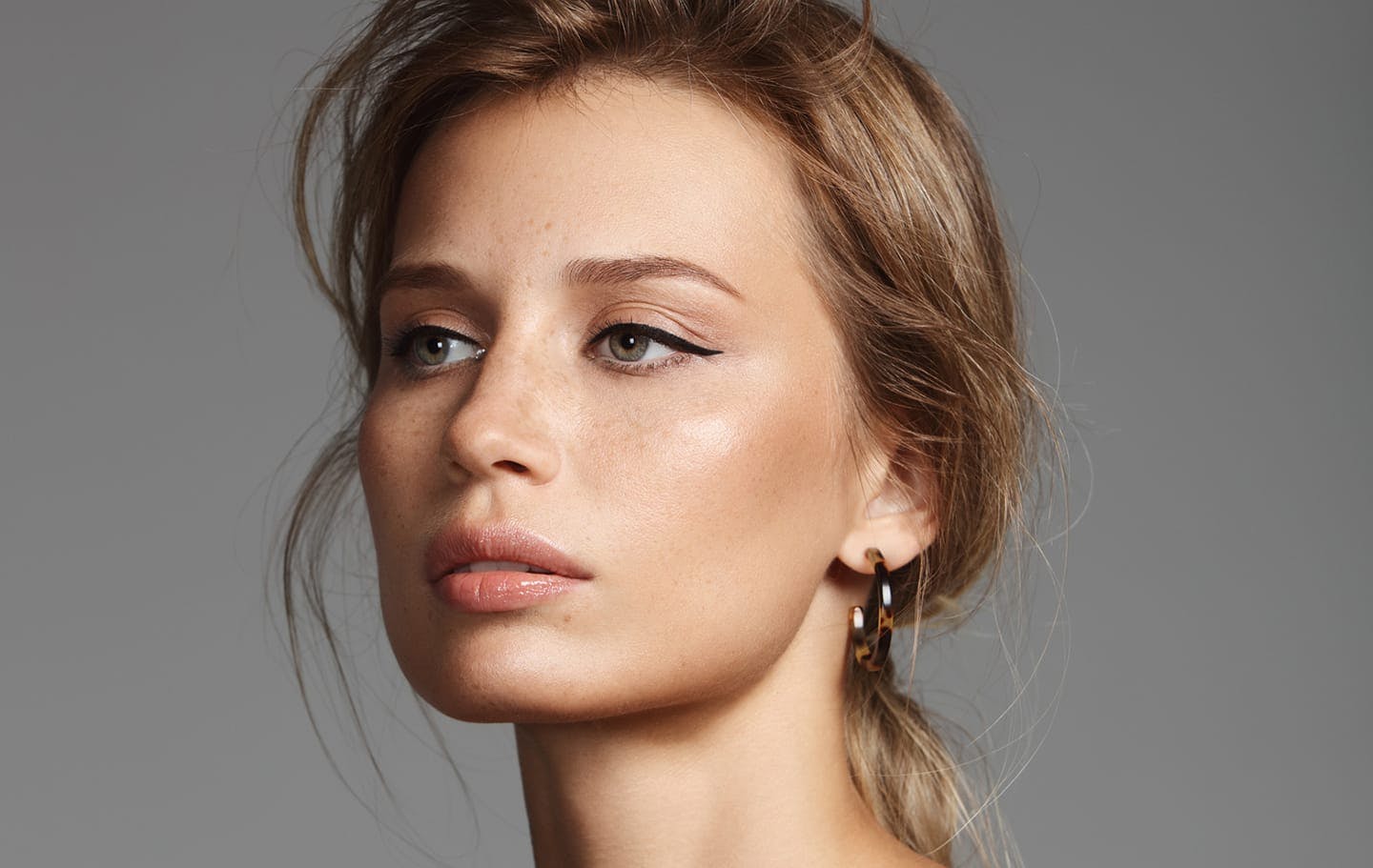 woman with hair pulled back