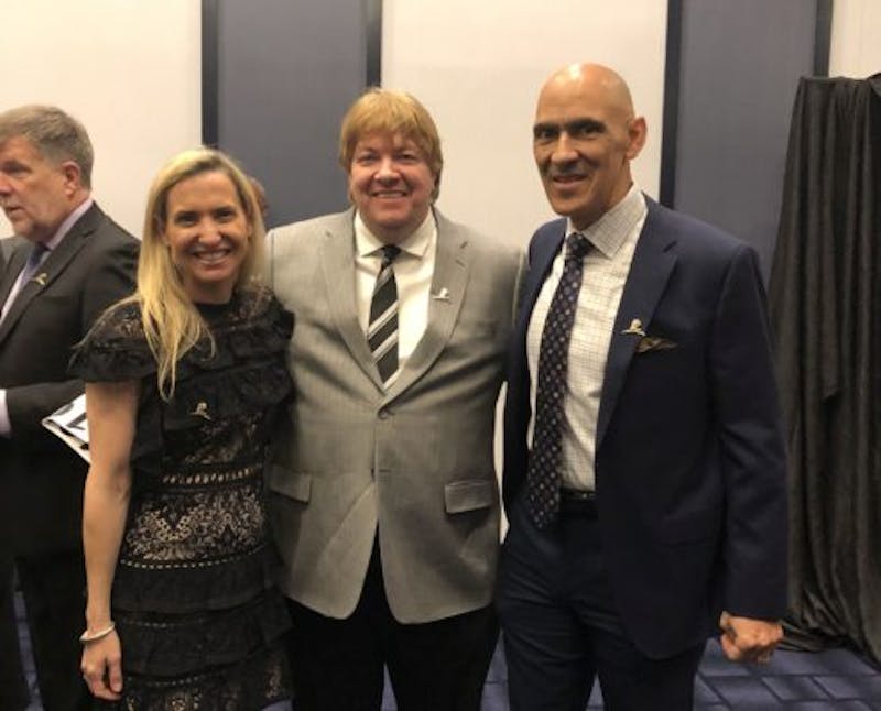 three Skin Care Doctors staff standing together in a convention room