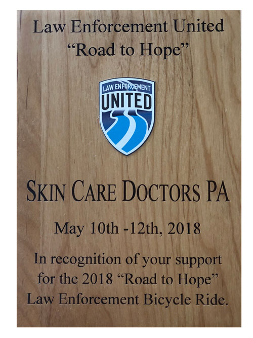 close up picture of 2018 Law Enforcement United award to Skin Care Doctors