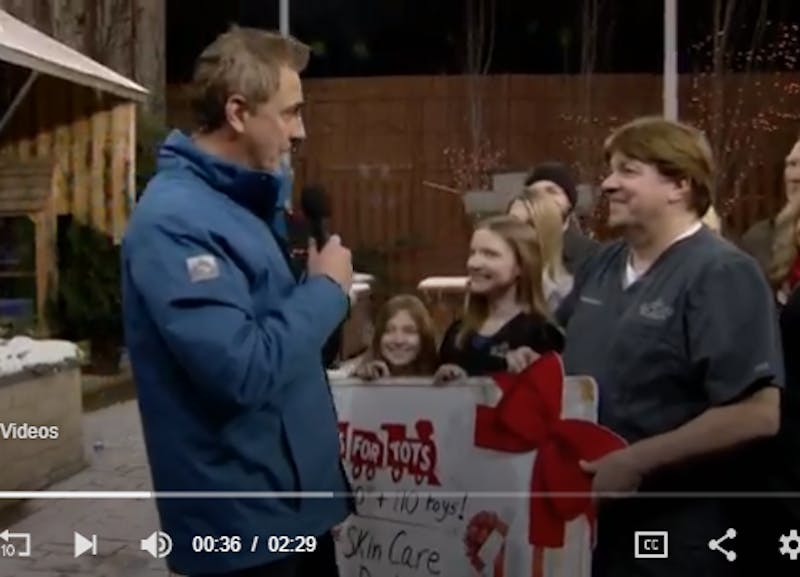 image of video of Toys for Tots donation by Skin Care Doctors