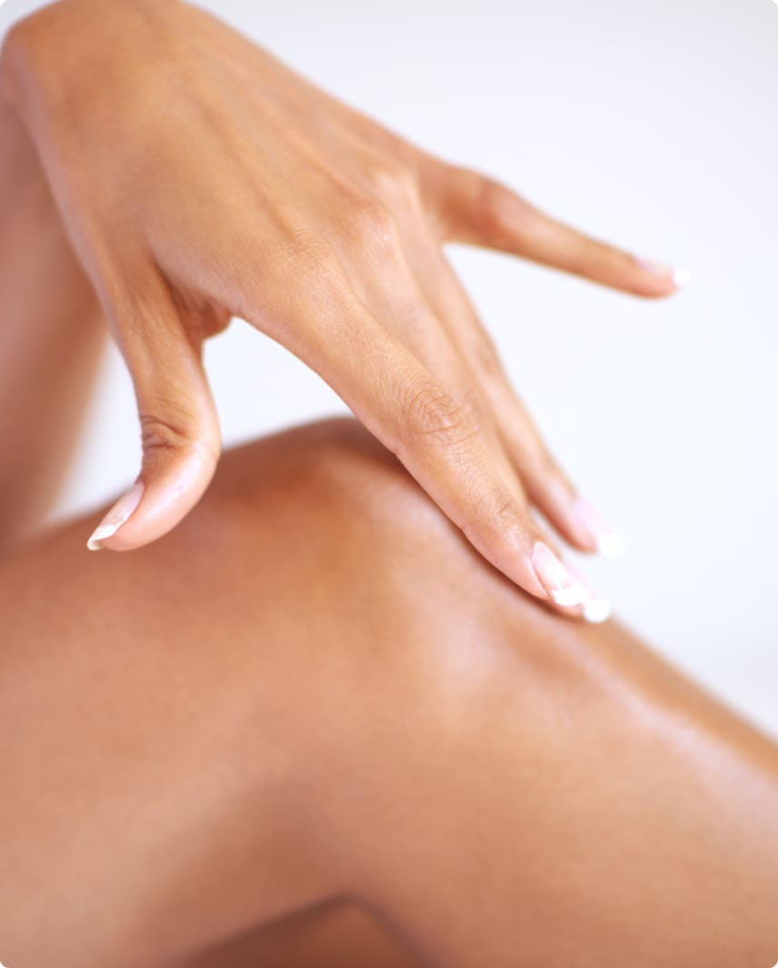 close up of woman touching knee