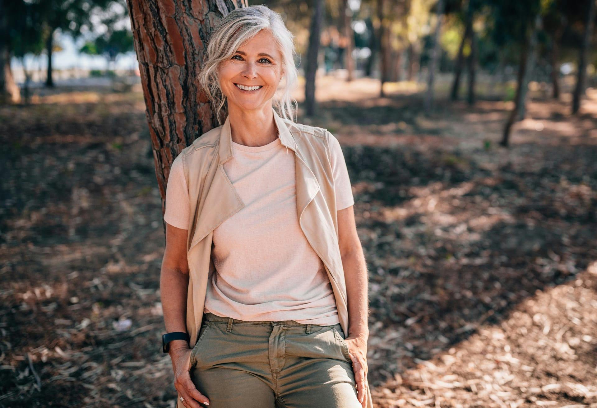 Woman outside around trees