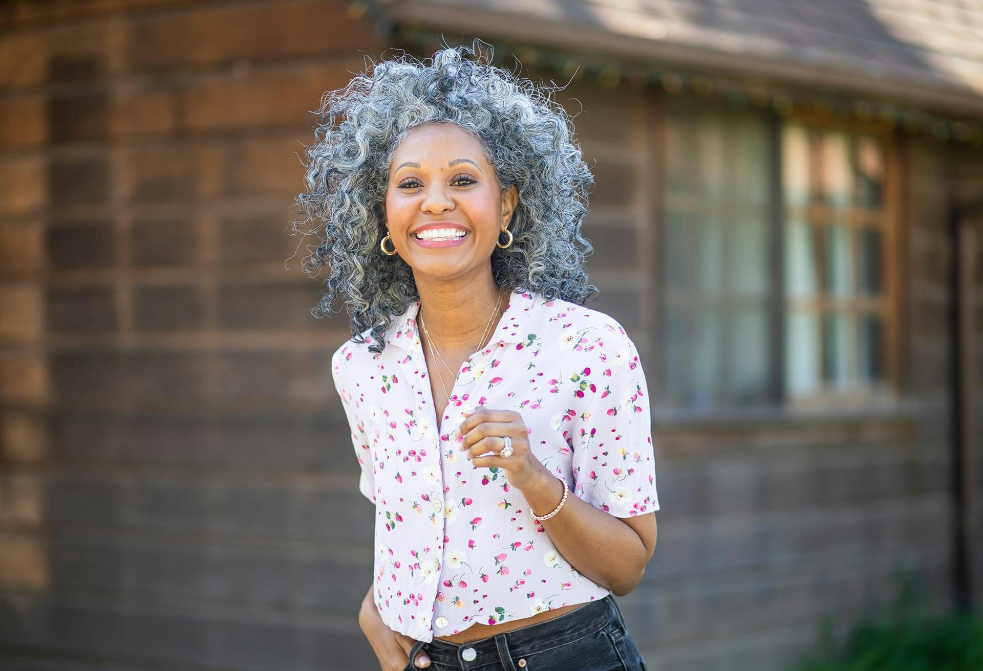 Woman with salt and pepper curly hair