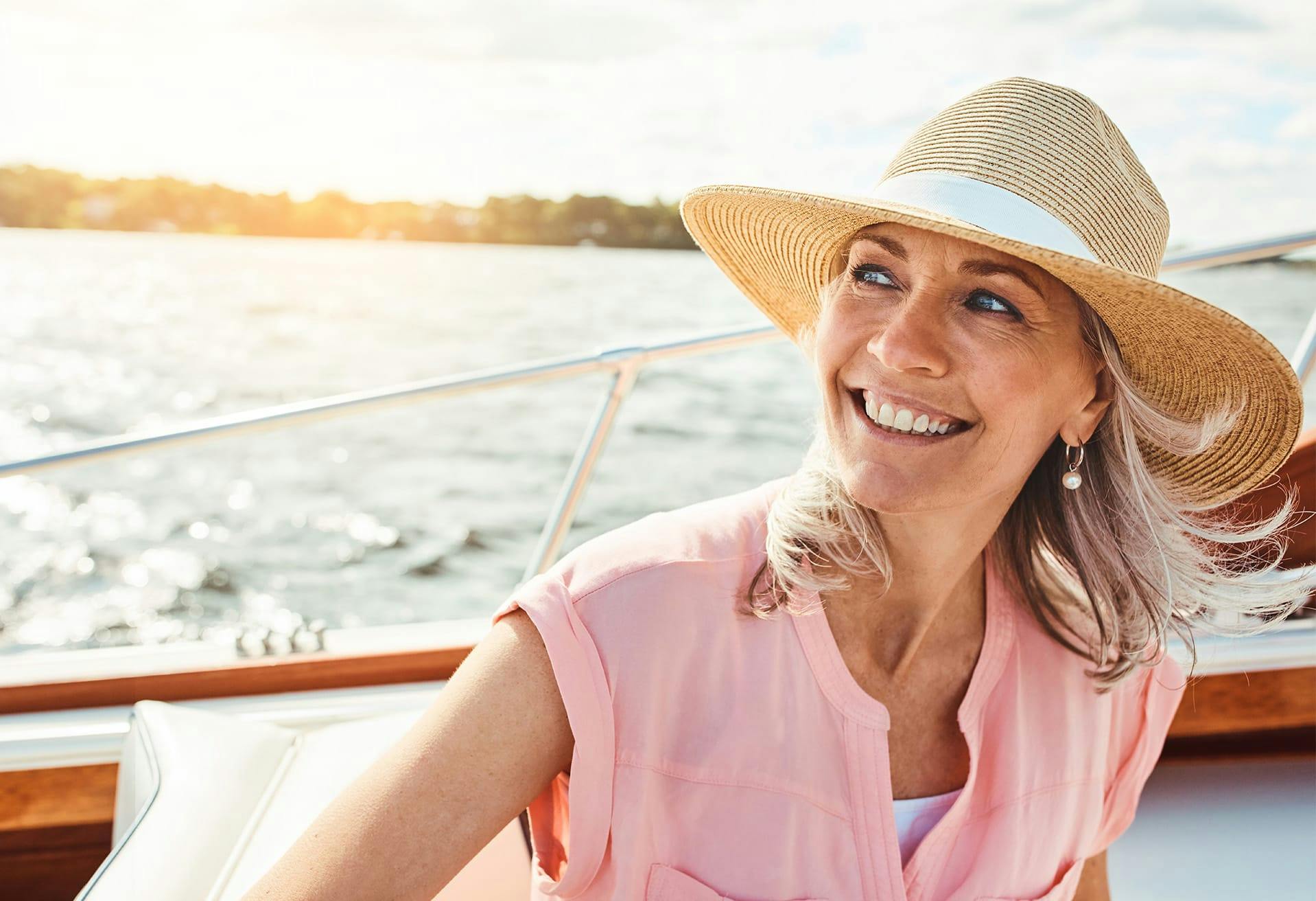 Woman on a boat wearing a sunhat
