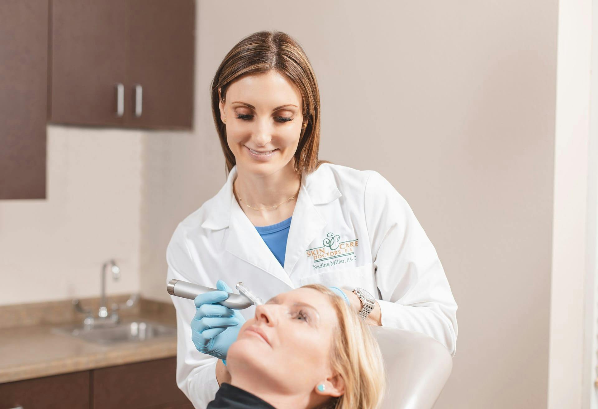 Nadine Miller, PA-C with a patient