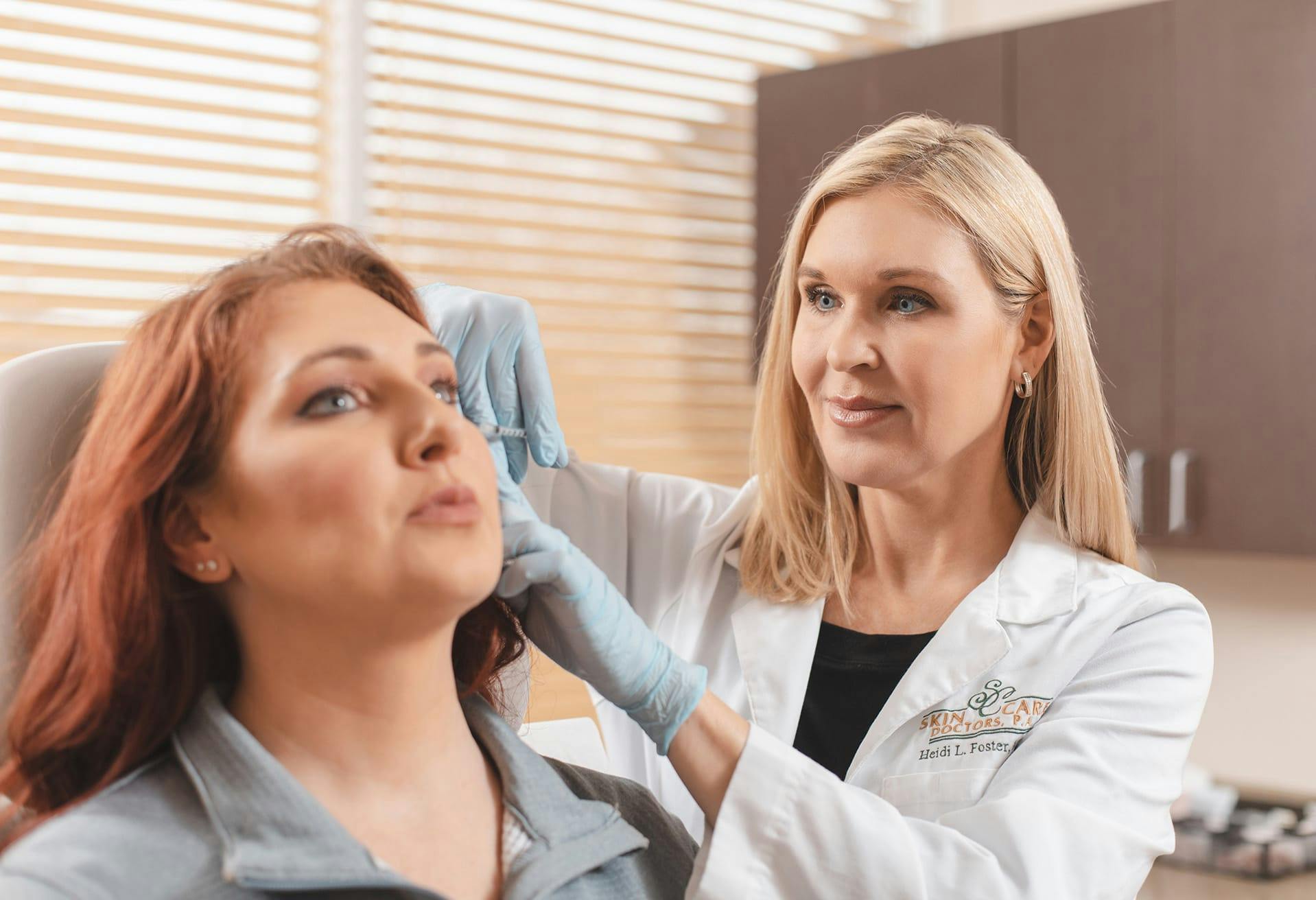 Heidi Foster, MD with a female patient