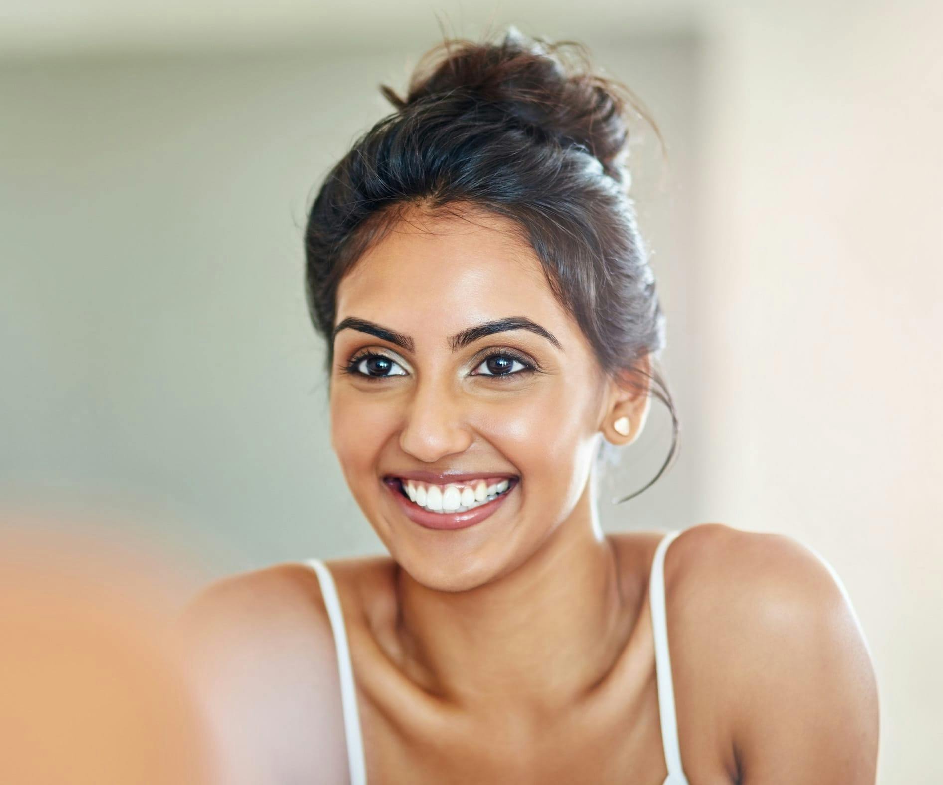 Woman smiling looking in the mirror