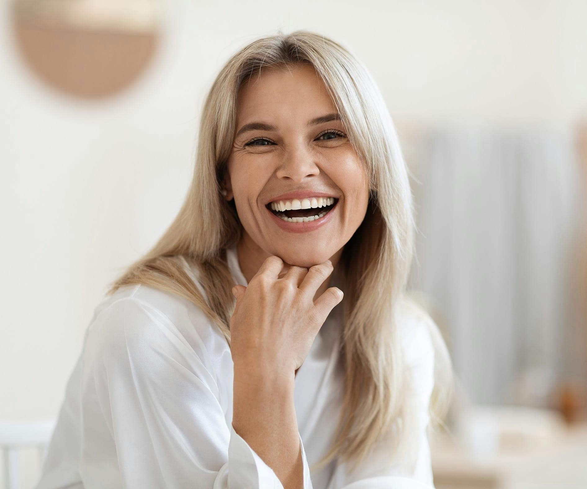 Woman with blonde hair laughing