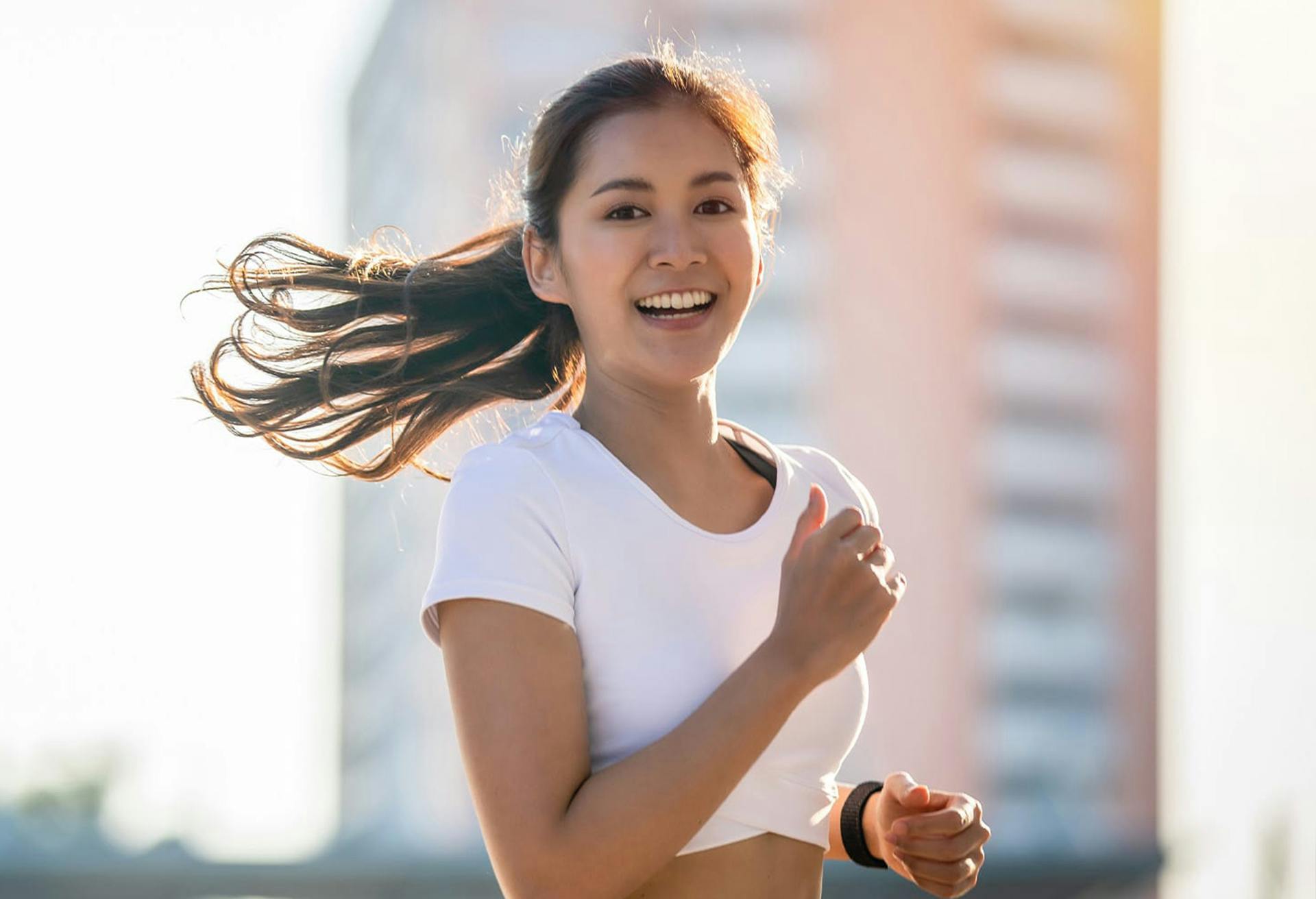 Young woman jogging outside