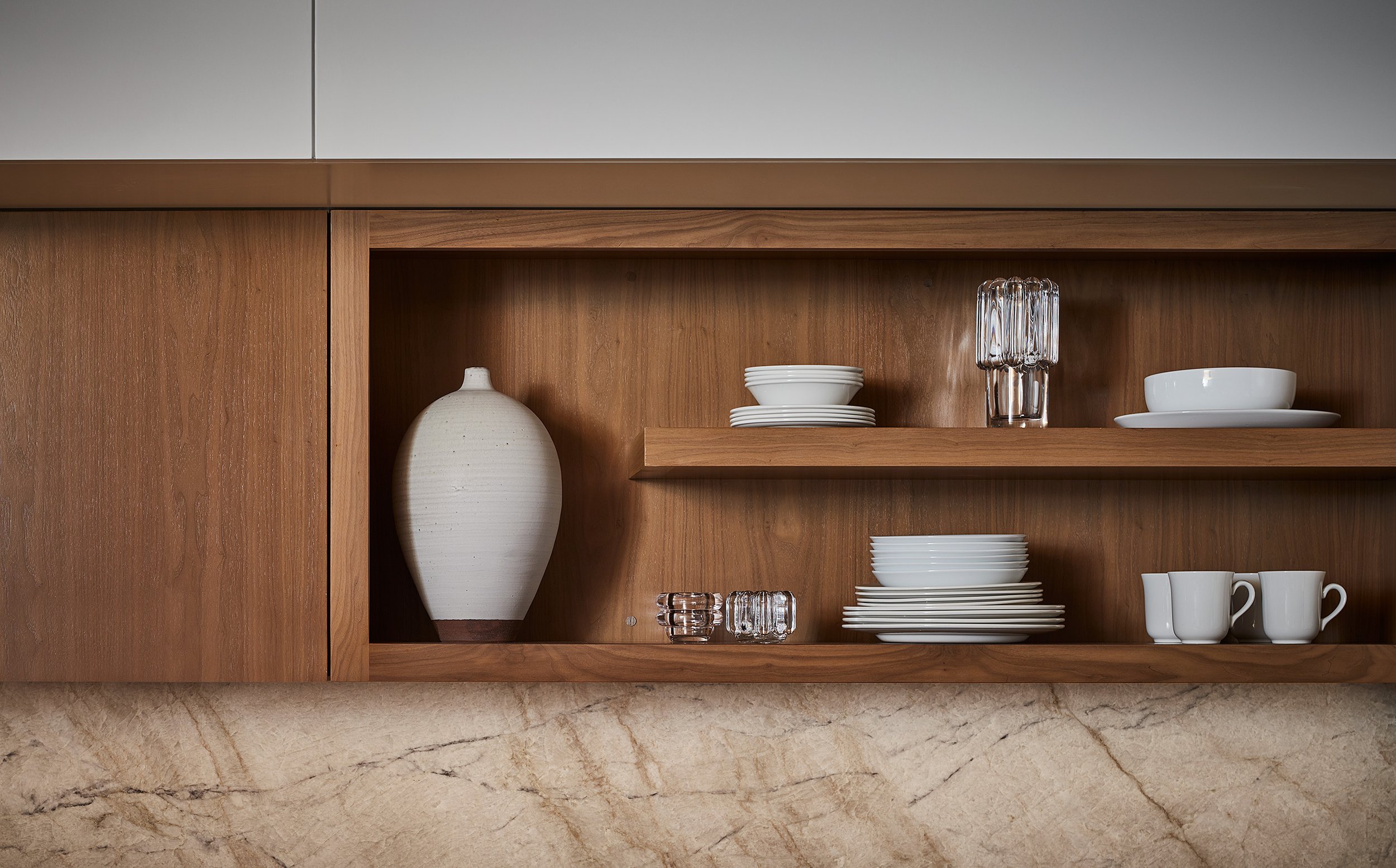 Cabinet detail with white dishes