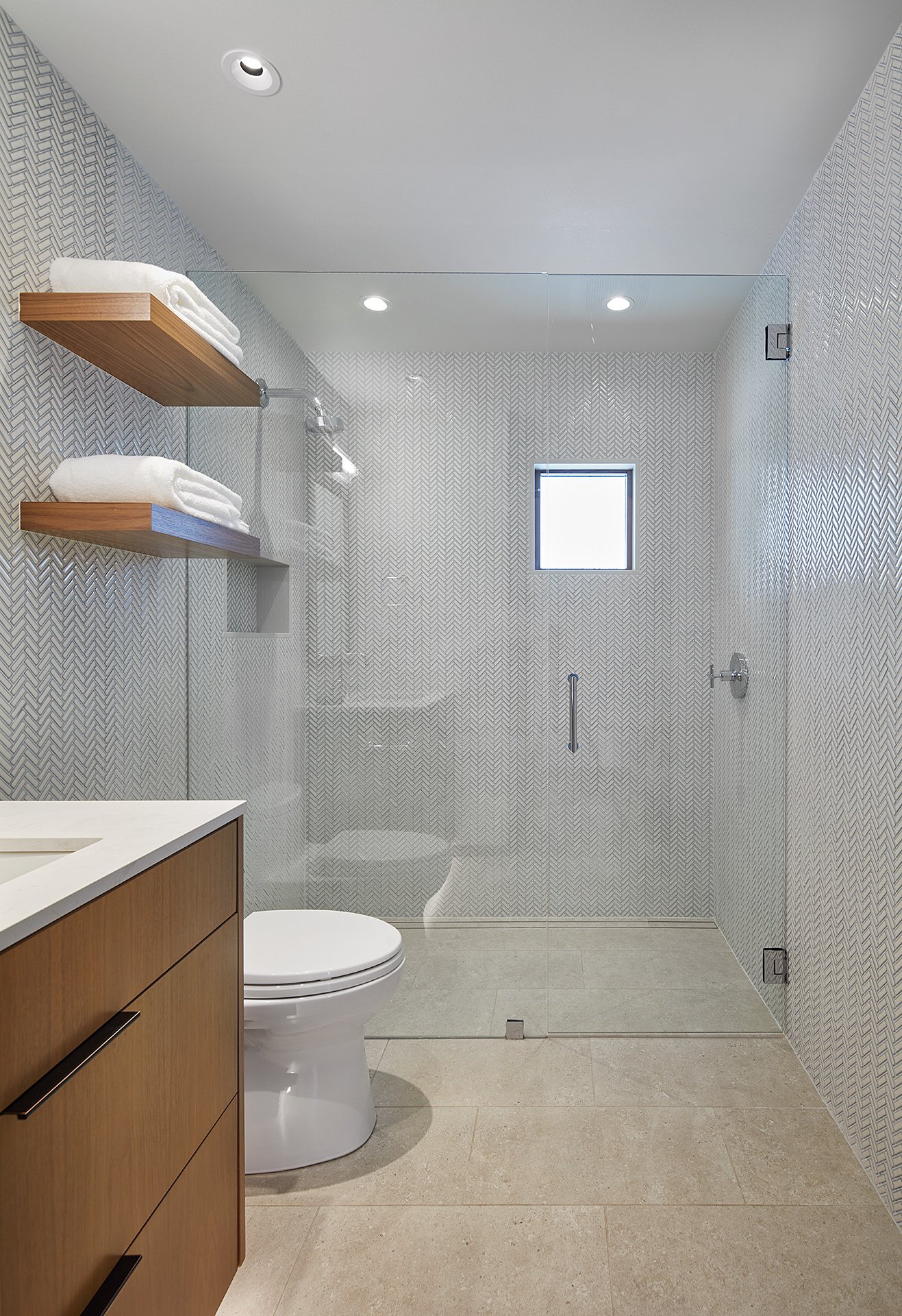 Bathroom with white herringbone tile