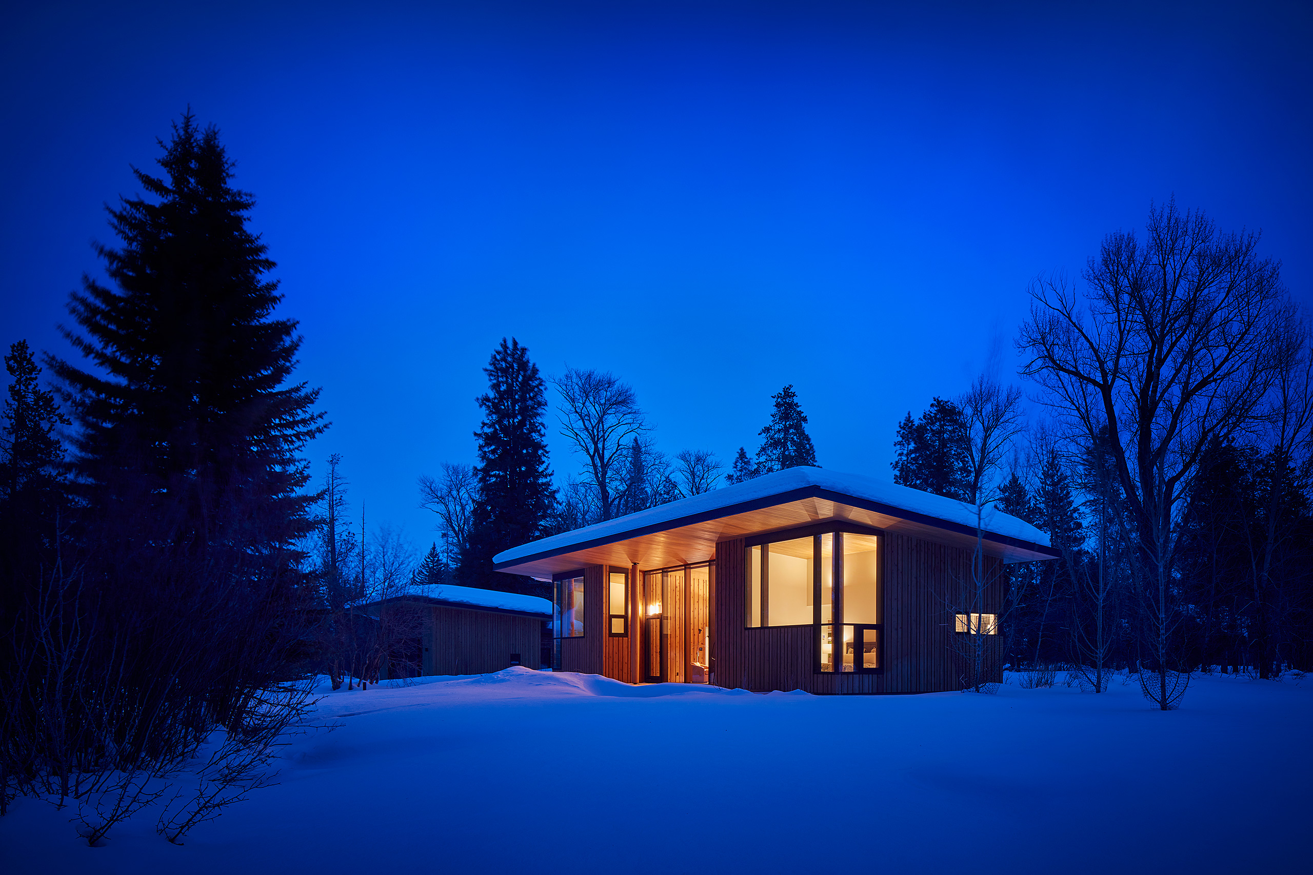Guest house at night in the snow