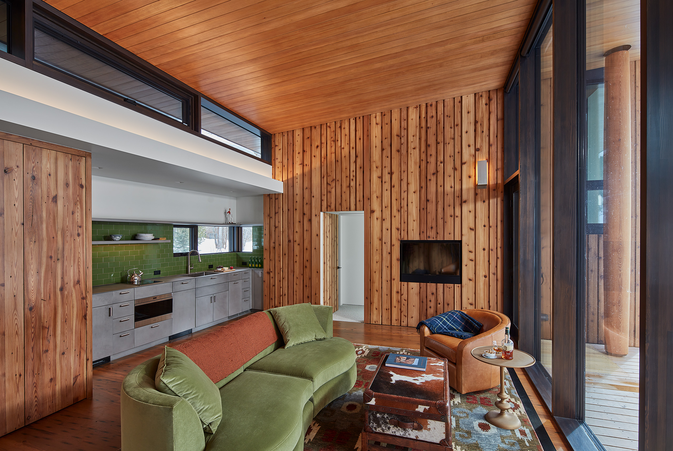 Living room and kitchenette of guest house knotty cedar and pine