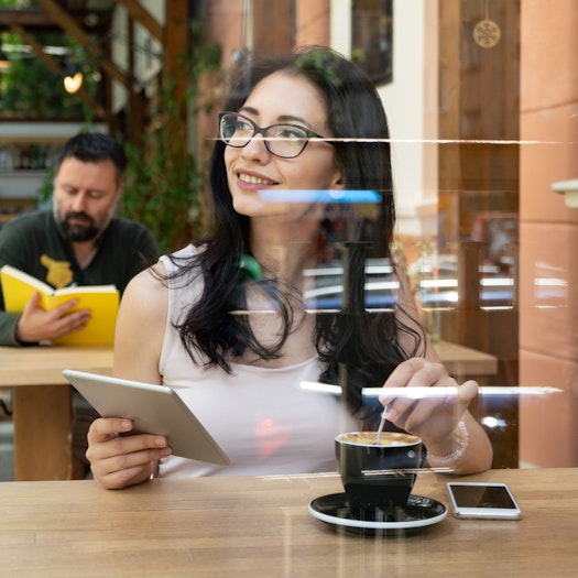Data scientist drinking coffee while working for startup