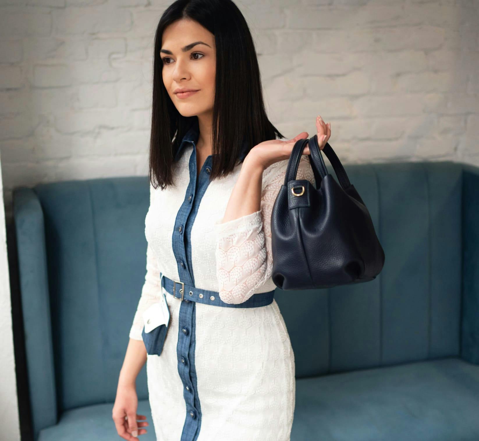 Beautiful woman holder a bag over her sholder.