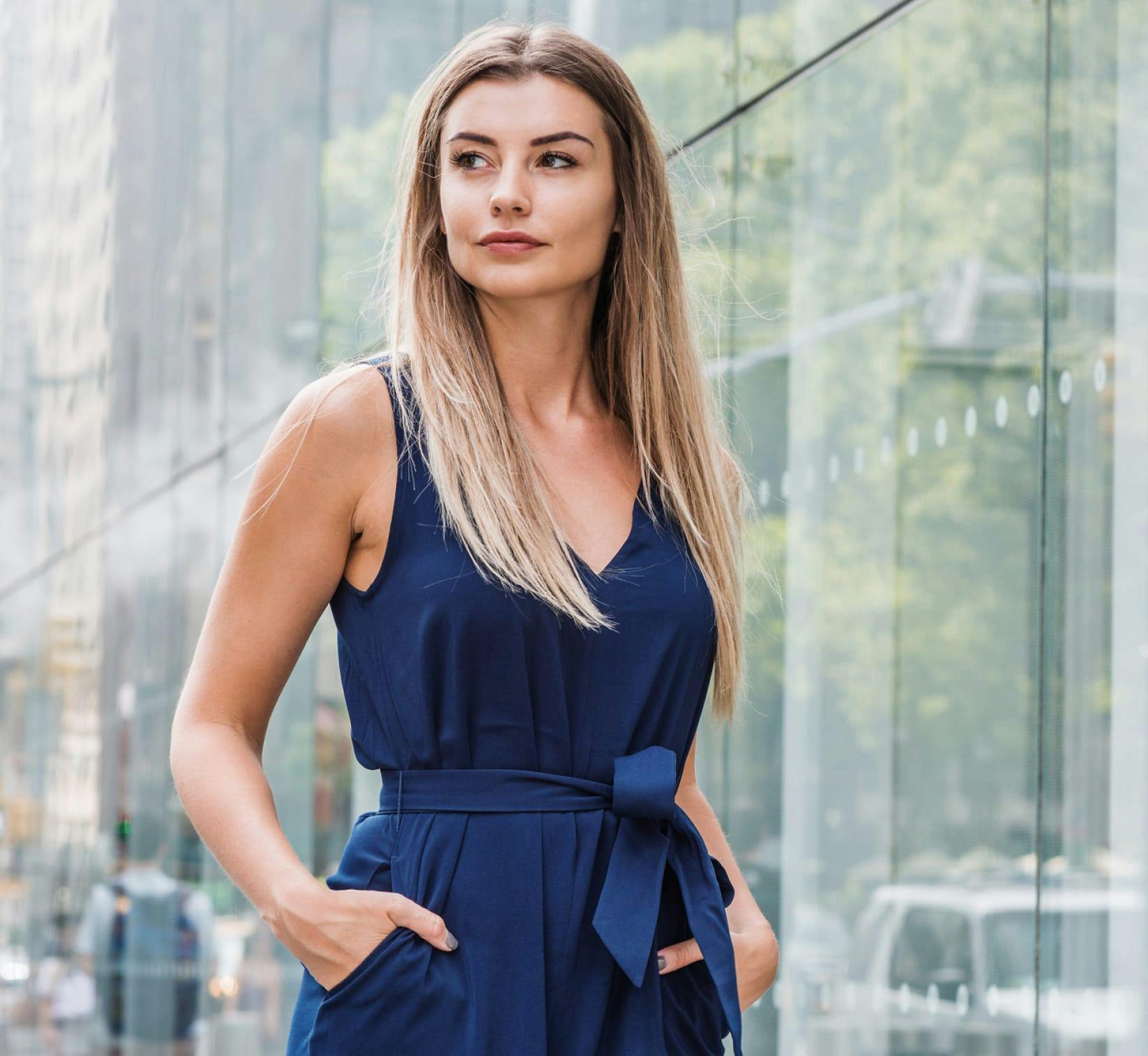 Gorgeous woman with her hands in her pocket.