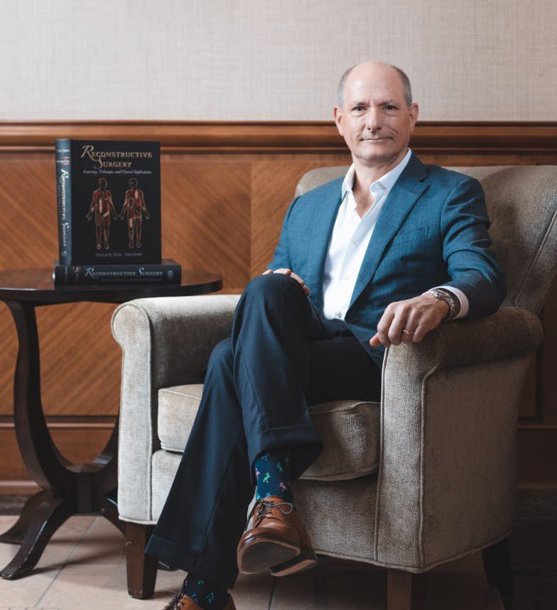 Dr. Zenn sitting in a chair