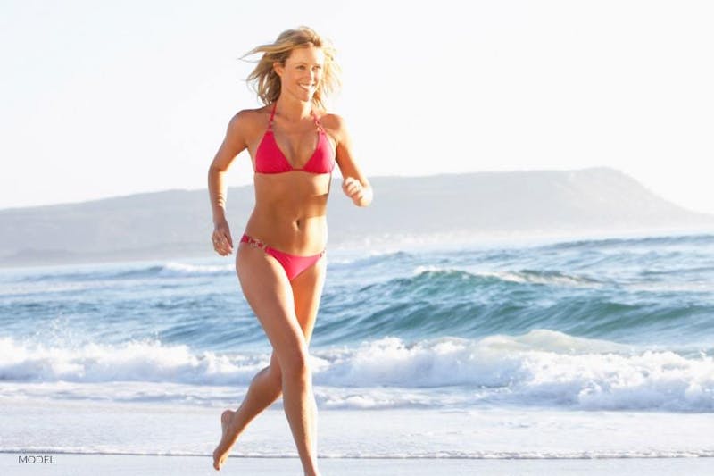 Woman running on beach