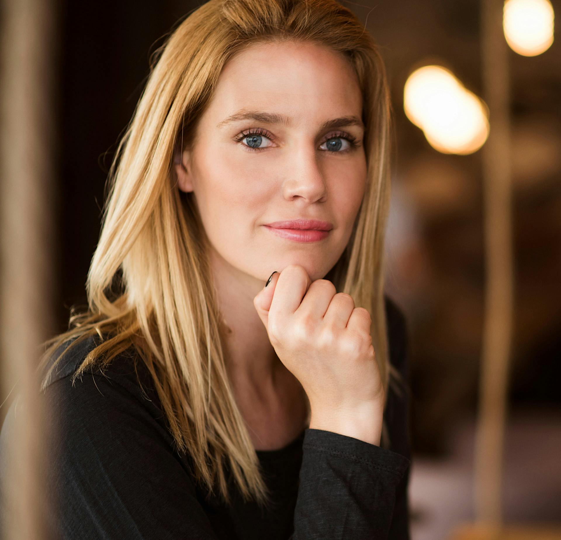 Woman with her hand on her chin