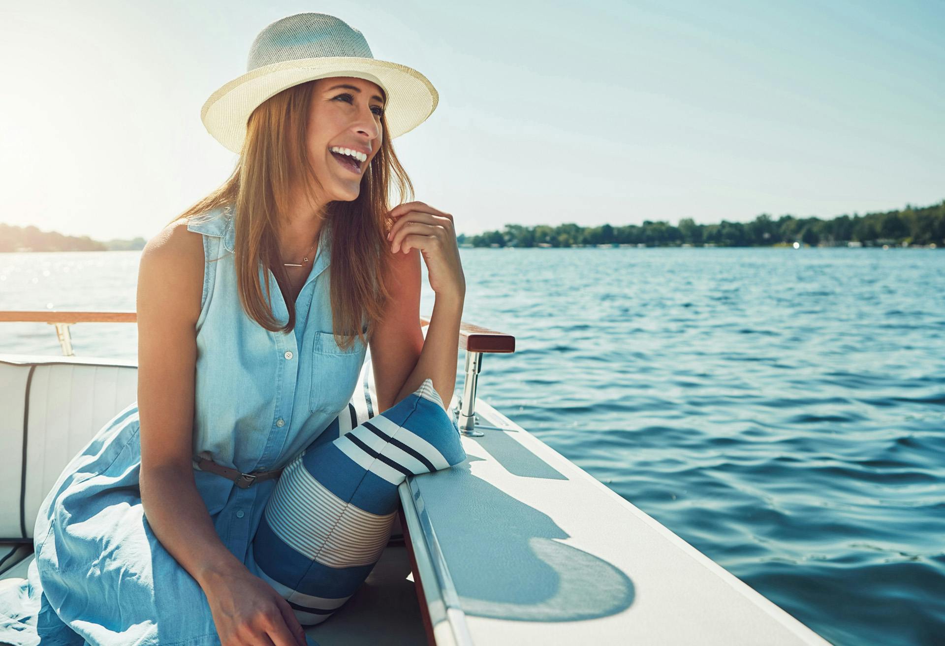 Woman sitting on a boat smiling