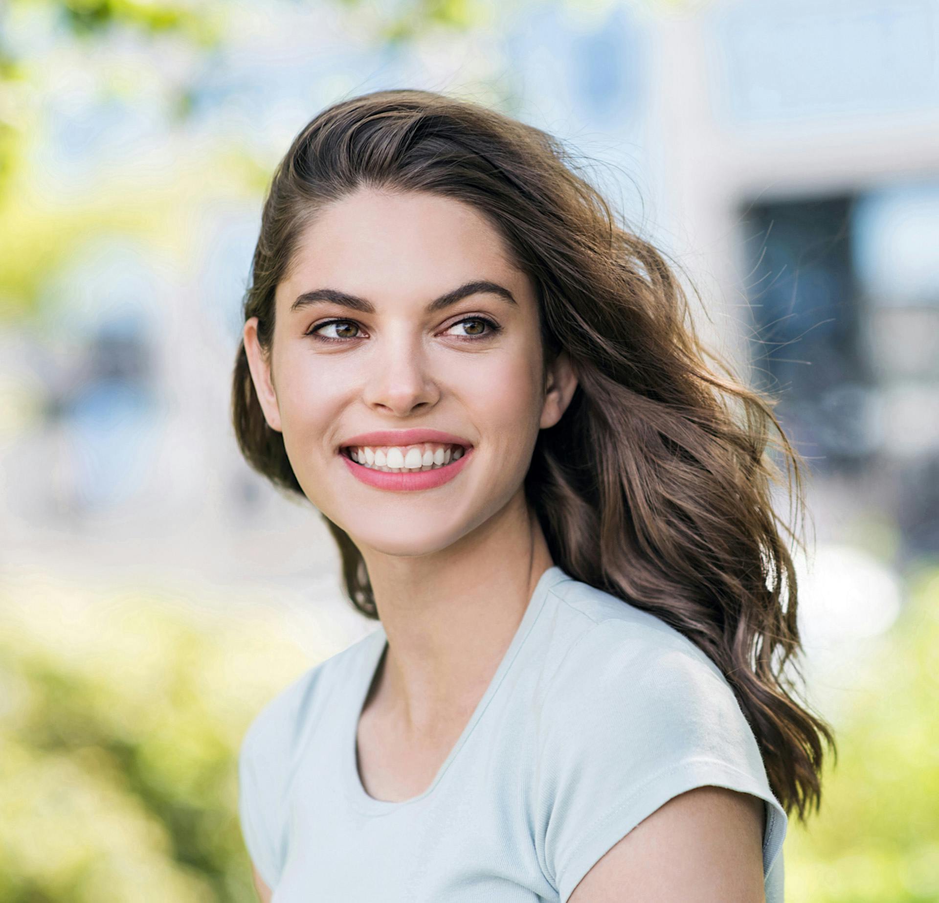 Woman in a white shirt smiling