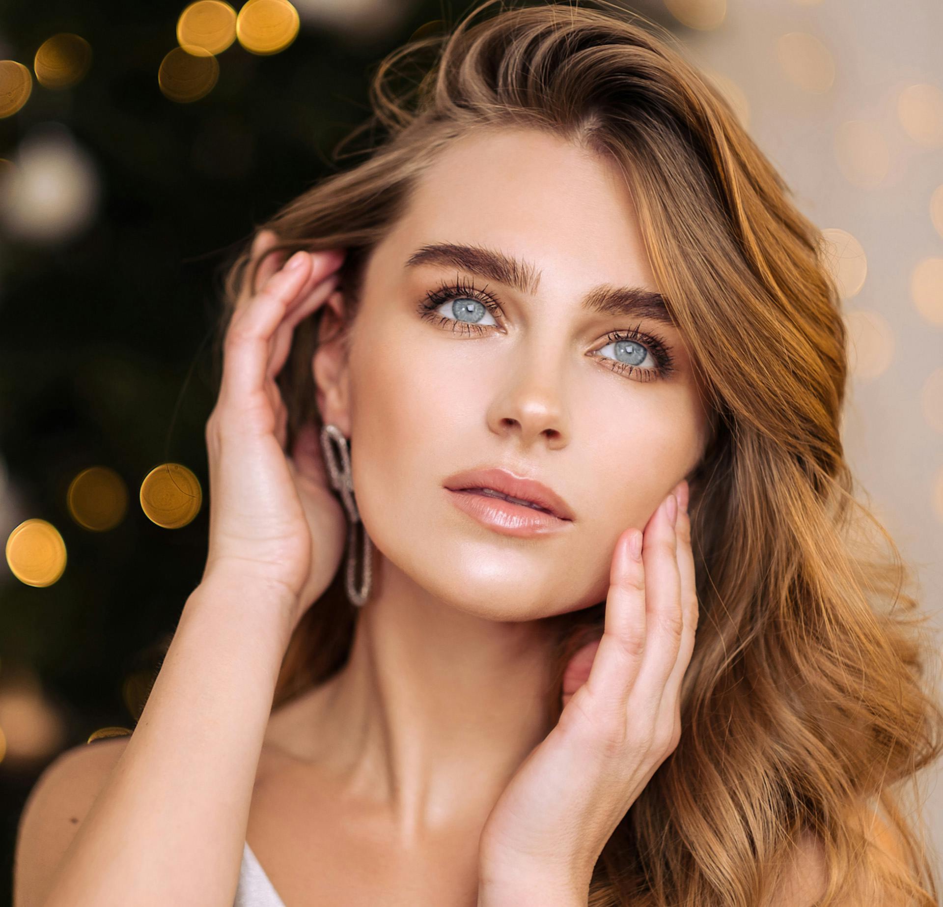 Woman with both hands on her face