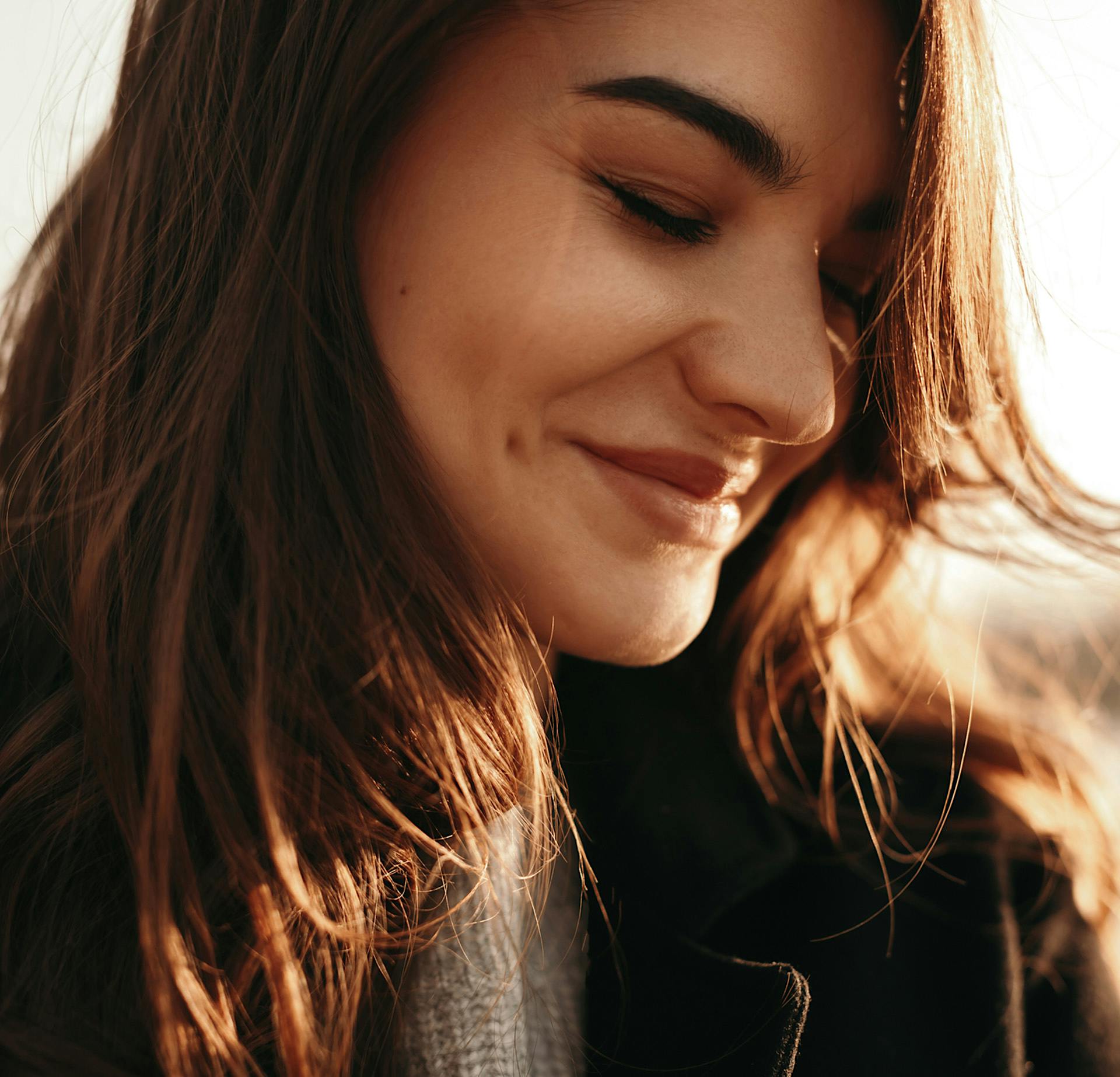Woman smiling and looking down