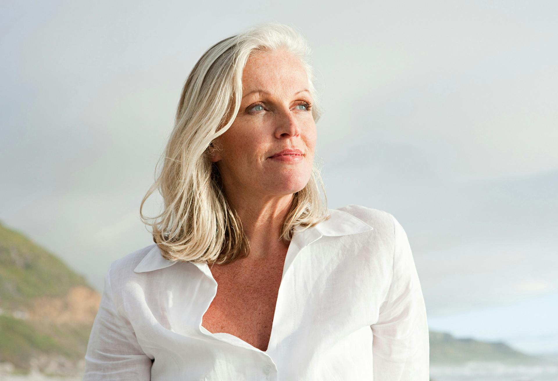 Woman in a white shirt looking to the side