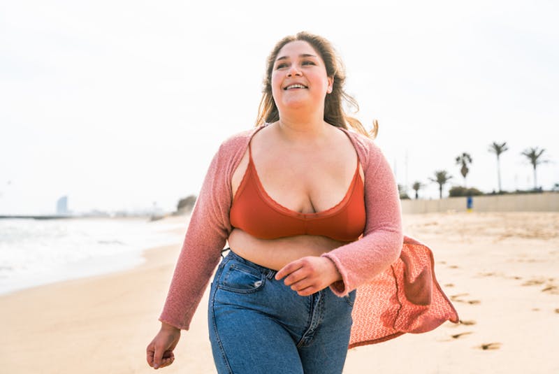 Woman in bikini top walking