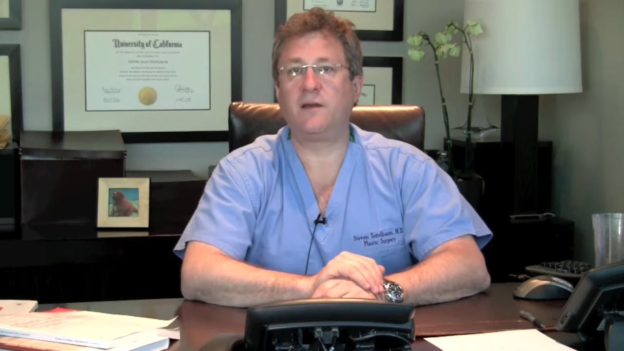 Dr Teitelbaum sitting at desk