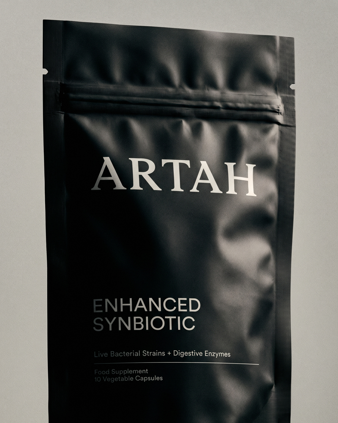 Two Times Elliott — ARTAH — rebrand hero shot of the matte black Enhanced Synbiotic stand-up pouch
