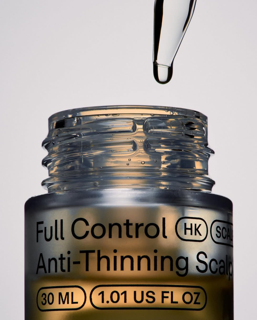 Hello Klean Full Control anti-thinning serum jar dripping, product photography by Two Times Elliott