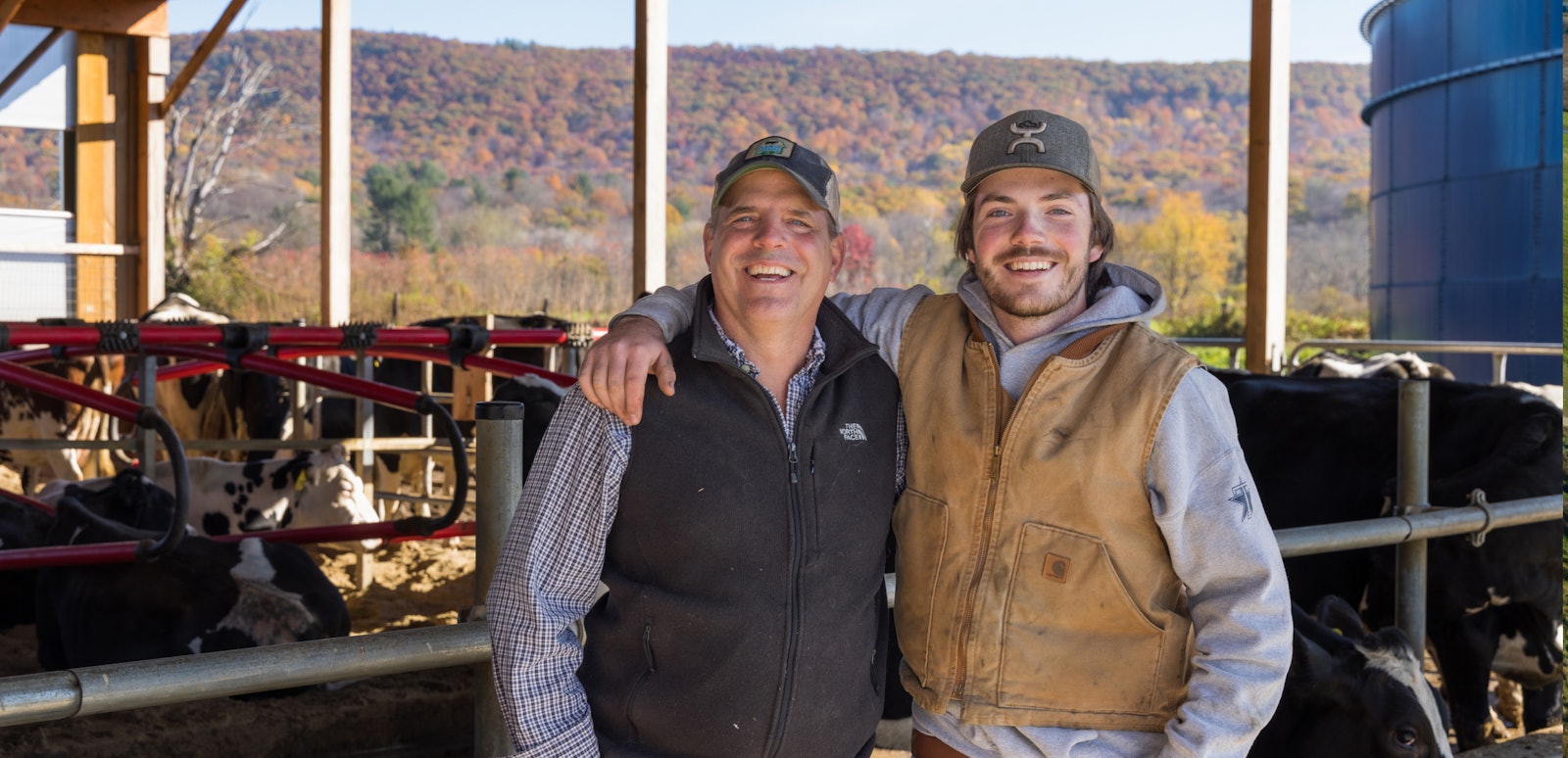 Two people on a dairy farm practicing regenerative agriculture