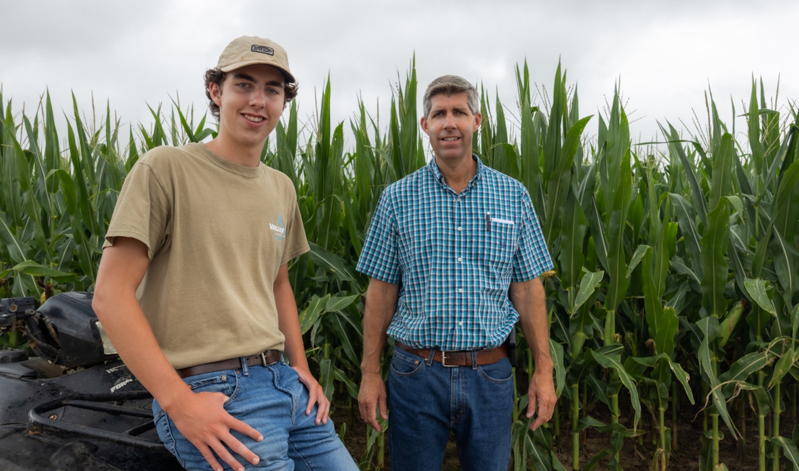 Two people on a farm practicing regenerative agriculture through anaerobic digestion