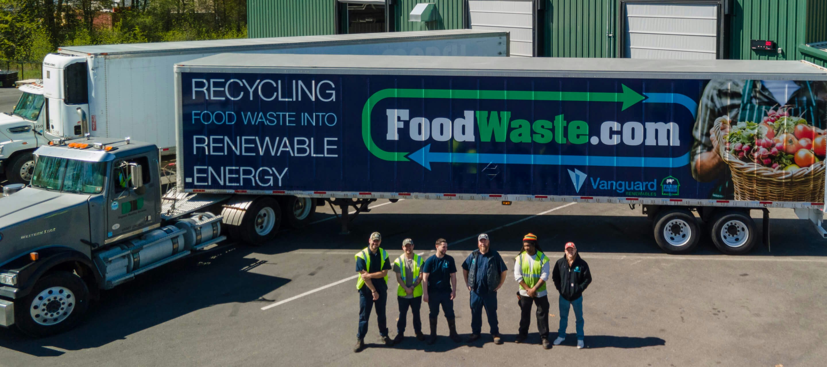 Group of Vanguard Renewables employees in front of a FoodWaste.com truck