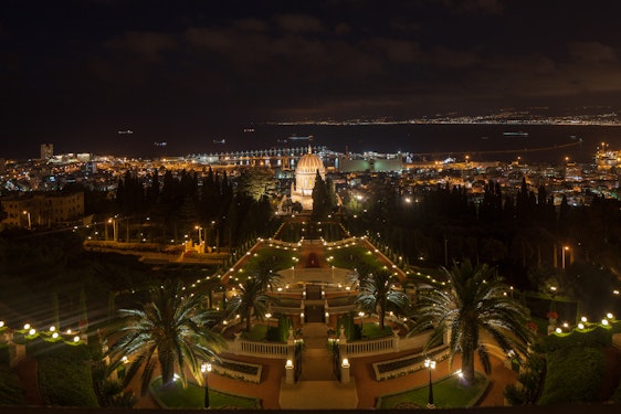 The terraces around the Shrine of the Báb are illumined at night.