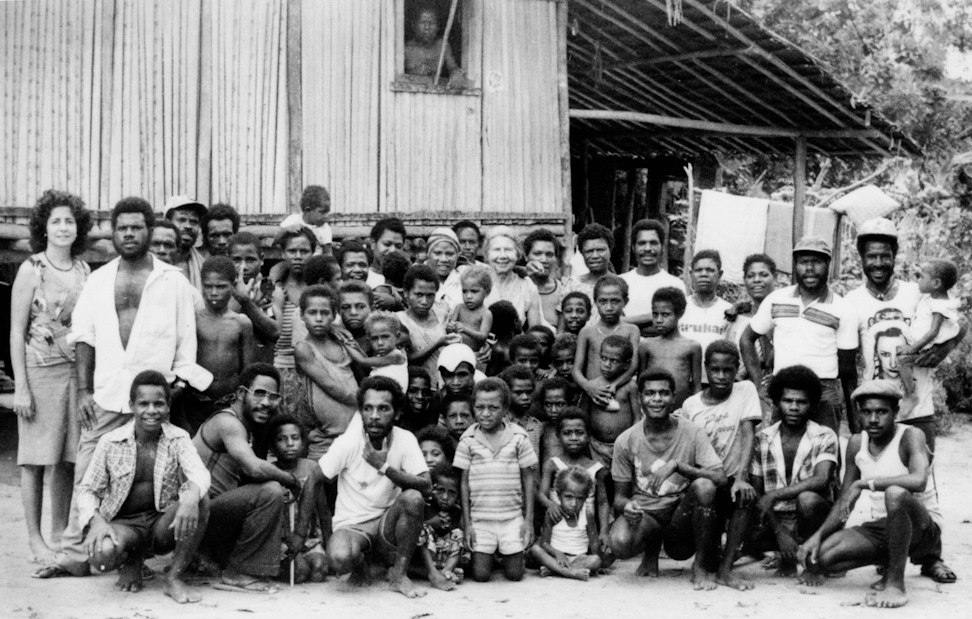 Violet Hoehnke (center) visiting Bahá’ís in the West Sepik region, Papua New Guinea, 1985