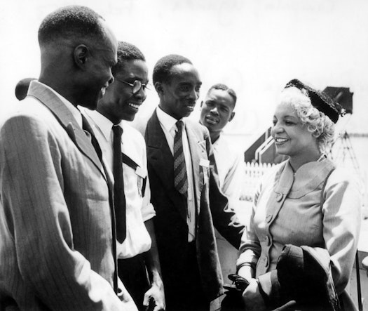Enoch Olinga, later to be appointed a Hand of the Cause (second left), and Elsie Austin (right) with other Bahá’ís at the African Intercontinental Bahá’í Conference, Kampala, Uganda, 1953