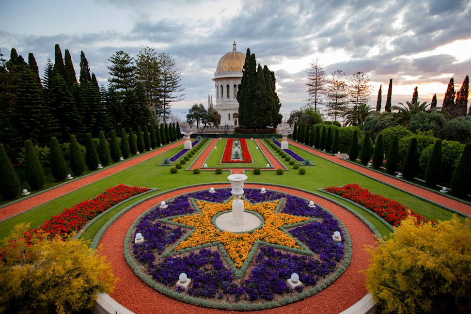 Flower bordered paths surround the Shrine of the Báb.