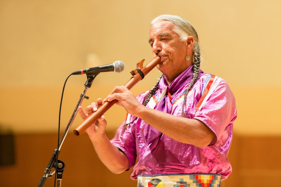 A Native American Bahá’í performed traditional music and hoop dances at an event in Illinois, United States, honoring the bicentenary of the birth of Bahá’u’lláh as well as Indigenous Peoples’ Day in October 2017.