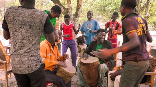 A group in Mwinilunga, Zambia, sings a welcoming song in preparation of the bicentenary of the birth of Bahá’u’lláh in September 2017.