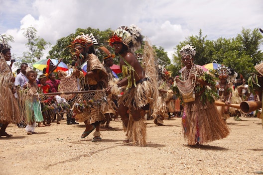 In celebration of the bicentenary of the birth of Bahá’u’lláh in October 2017, a group performs a traditional dance in Port Moresby, Papua New Guinea, at the site where the Bahá’í House of Worship will be built.