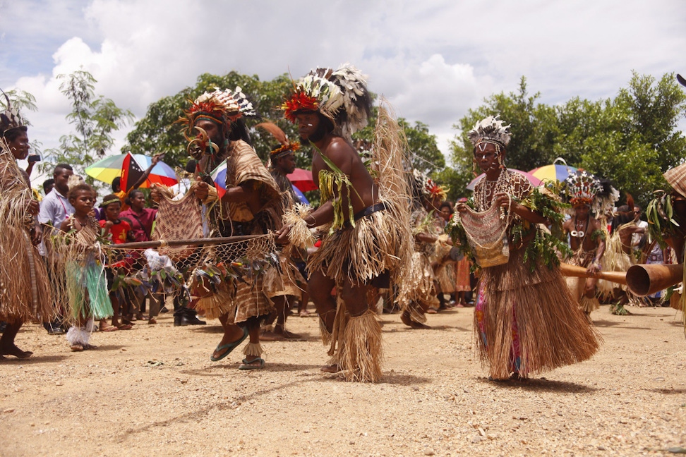 In celebration of the bicentenary of the birth of Bahá’u’lláh in October 2017, a group performs a traditional dance in Port Moresby, Papua New Guinea, at the site where the Bahá’í House of Worship will be built.