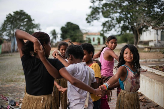 Children participate a group activity in preparation for celebrations of the bicentenary of Bahá’u’lláh in the Kiriri community in Banzae, Brazil, in October 2017.
