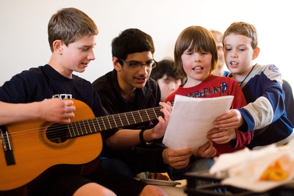 A group performing music as part of their study of the spiritual empowerment of junior youth in Vancouver, Canada