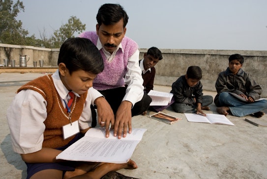 A group studying the spiritual empowerment of junior youth in Biharsharif, India